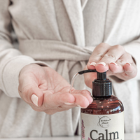 Oil being pumped out of Calm Massage Oil bottle