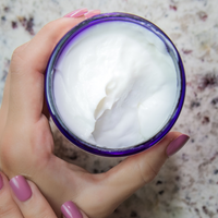 Relax Therapeutic Massage Lotion being applied to a hand