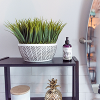 Relax Therapeutic Massage Oil on a table in a bathroom