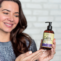 Calm Massage Oil being used by woman