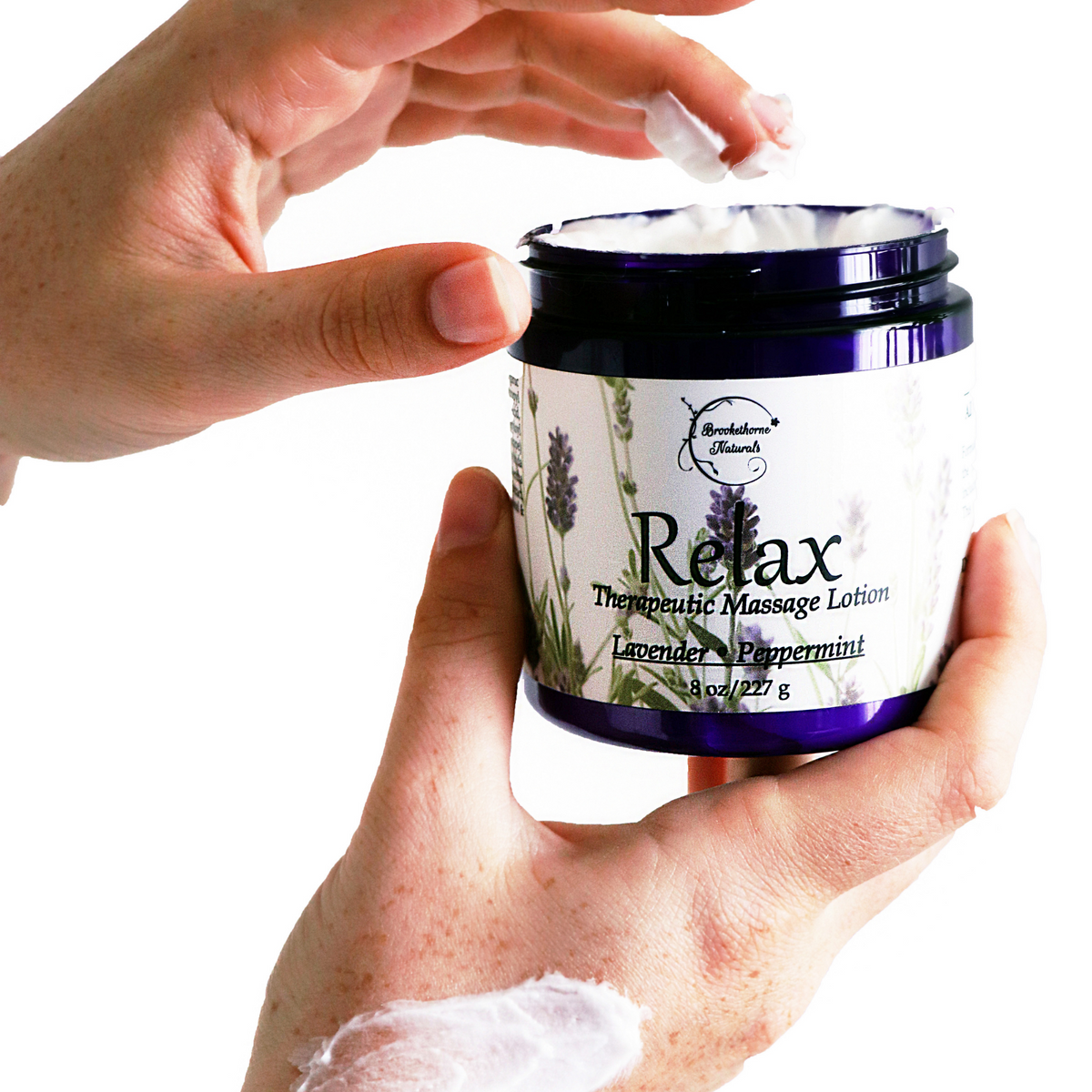 Relax Therapeutic Massage Lotion being applied to a hand