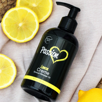 Passion Lemon Creme Sensual Massage Oil surrounded by lemons and other decorations