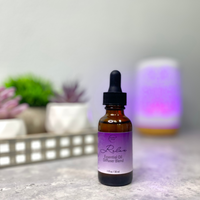 Relax Essential Oil Diffuser Blend with succulents and diffuser in the background