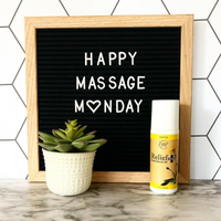 Happy Massage Monday Sign with Relief Plus Arnica Muscle Oil next to it